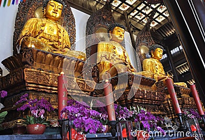 Sitting Buddha statues from the Jade Buddha Temple interior in Shanghai Stock Photo