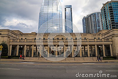 A majestic shot of the glass skyscrapers office buildings in the cityscape with a brown stone building with tall pillars Editorial Stock Photo