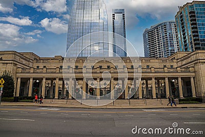 A majestic shot of the glass skyscrapers office buildings in the cityscape with a brown stone building with tall pillars Editorial Stock Photo