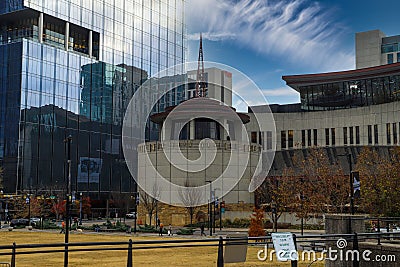 A majestic shot of the skyscrapers and the office buildings in the cityscape with gorgeous autumn trees, blue sky Editorial Stock Photo