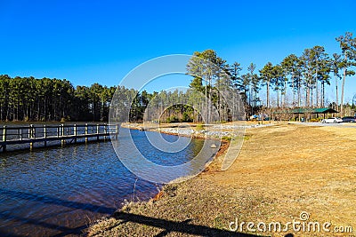 A majestic shot of the still blue lake waters of Lake McIntosh in Peachtree City, Georgia Stock Photo