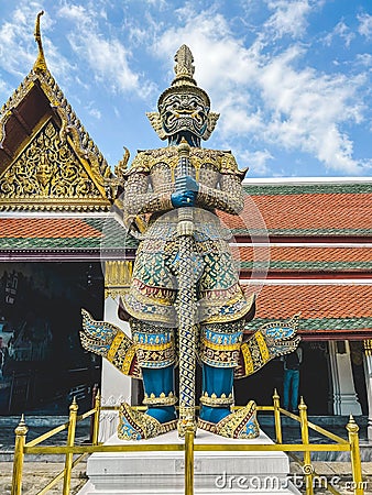 Majestic stone figure of a demon guardian in the grand palace of Wat Phra Kaew in Bangkok, Thailand Editorial Stock Photo