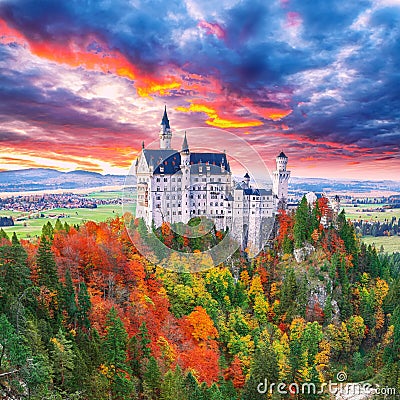 Majestic sunset view of famous Neuschwanstein Castle in autumn Stock Photo