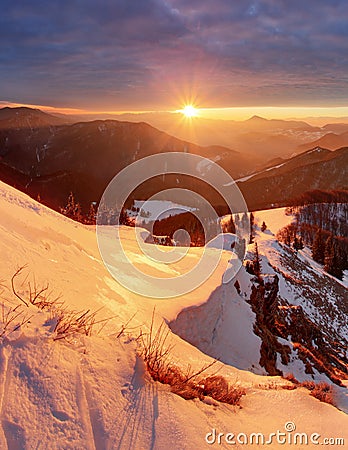 Majestic sunset in the winter mountains landscape. Dramatic sky Stock Photo