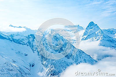 Majestic view of winter sunny day of Dombaj mountains with blue Stock Photo