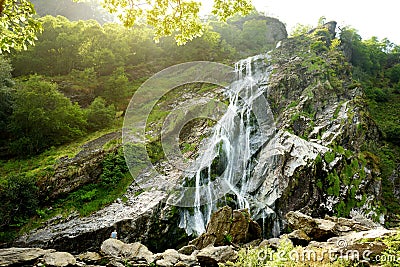 Majestic water cascade of Powerscourt Waterfall, the highest waterfall in Ireland. Stock Photo