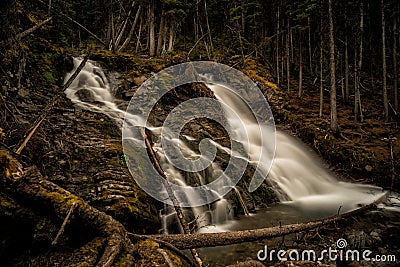 A majestic waterfall in the forests and mountains of Peter Lougheed Provincial Park. Kananaskis Lakes, Alberta. Canada Stock Photo