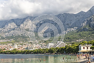 Makarska September 2018 Croatia. view of the beach of Makarska with green pine trees Editorial Stock Photo