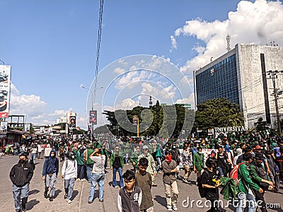 Makassar, Indonesia-11 April 2022- Demonstrators demanding stability in staple food prices and rejecting an 11% tax increase Editorial Stock Photo