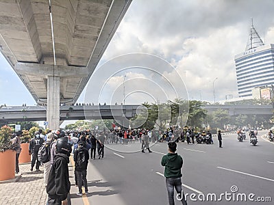 Makassar, Indonesia-11 April 2022- Demonstrators demanding stability in staple food prices and rejecting an 11% tax increase Editorial Stock Photo