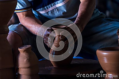 Make a clay mortar Thai. Hands of a potter at work. making ceramic mug Stock Photo