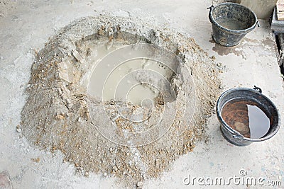 Make concrete pile with bucket full water Stock Photo