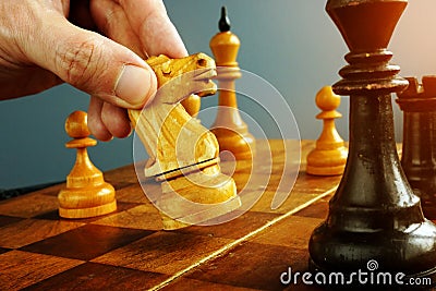 Make decisions and challenge. Chess player makes a move Stock Photo