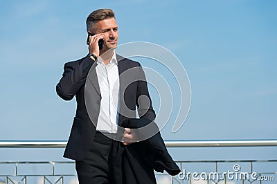 Make decisions on the go. Business concept. Business life. Man classic style blue sky background. Mobile communication Stock Photo