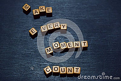Make every moment count message written on wooden blocks. Motivation concepts. Cross processed image Stock Photo