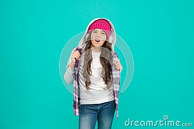 Make her wanna dance. small child long hair enjoy sound. happy childhood. happy hipster girl turquoise background Stock Photo