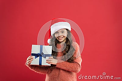 Make kids happy. Small child enjoy christmas tradition. Gifts delivery service. Emotional child. Little girl hold gift Stock Photo