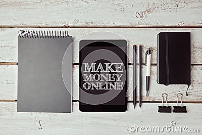 Make money concept with digital tablet and office items Stock Photo