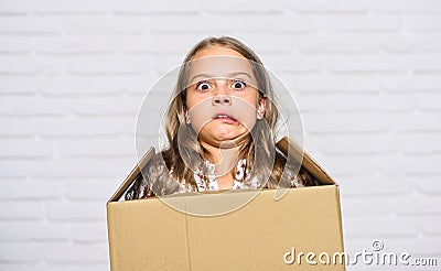 Make moving easier. Girl small child carry cardboard box. Move out concept. Prepare for moving. Rent house. Real estate Stock Photo