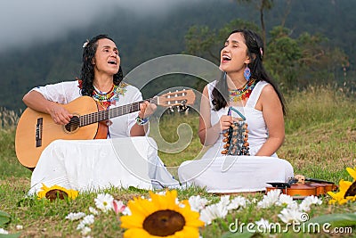 Make music outdoors. Women playing an instrument. Stock Photo