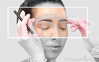 Make-up artist makes markings with white pencil for eyebrow and paints eyebrows. Professional makeup and facial care Stock Photo