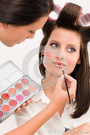 Make-up artist woman fashion model apply lipstick Stock Photo