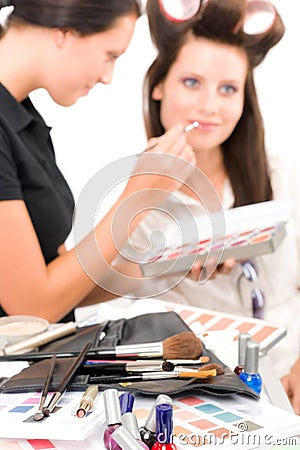 Make-up artist woman fashion model apply lipstick Stock Photo