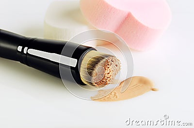 make-up brush, sponges and smear makeup base on a white background, copyspace, horizontal Stock Photo