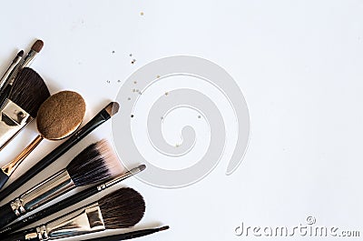 Make up brushes flatlay on white background. Stock Photo