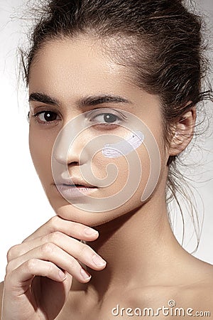 Make-up & cosmetics. Beautiful model with clean skin, foundation concealer cream Stock Photo