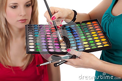Make-up girl showing range of collors Stock Photo