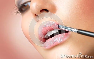 Make-up. Lipgloss Applying Stock Photo