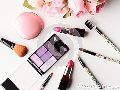 Make up products and tools with pink roses Stock Photo