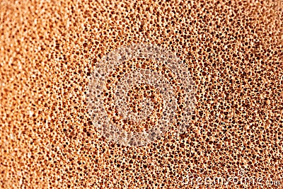 Make-up sponge close-up texture. Macro porous beige Stock Photo