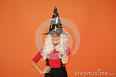 Make wish. supernatural charmer. kid enchantress wave magic wand. happy halloween. believe in magic. smiling small girl Stock Photo