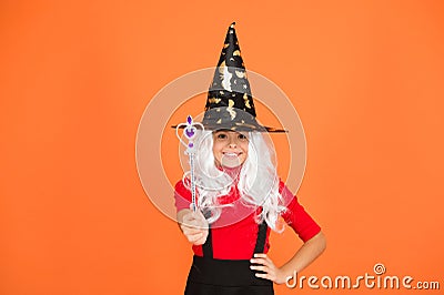 Make wish. supernatural charmer. kid enchantress wave magic wand. happy halloween. believe in magic. smiling small girl Stock Photo
