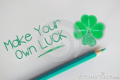 Make your own luck motivational quote with four leaf clover as lucky symbol Stock Photo