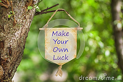 Make your own luck on Paper Scroll Stock Photo