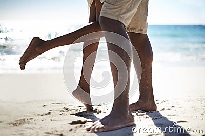 He makes her swoon. Cropped image of an african-american couple being affectionate on the beach. Stock Photo