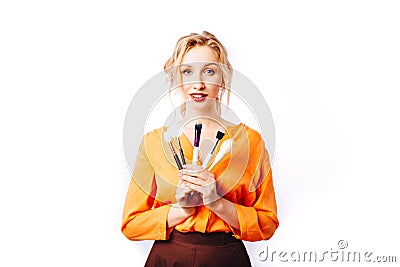 Makeup artist with brushes Stock Photo