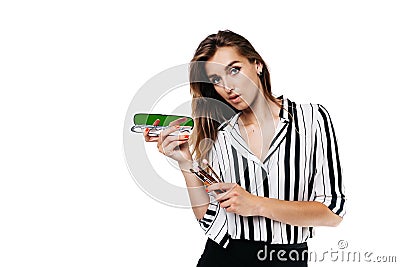 Makeup artist girl on a white background with brushes Stock Photo