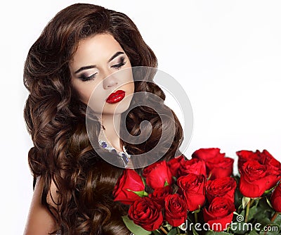 Makeup. Beautiful young woman with bouquet of red roses isolated Stock Photo