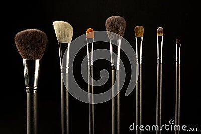 Makeup brushes on a black background Stock Photo