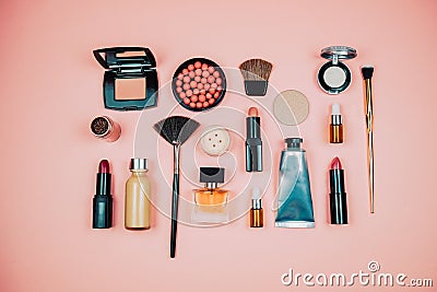 Makeup cosmetic product flay lay on pink background. woman and girl beauty concept . lipstick, brush and eye shadow. Stock Photo