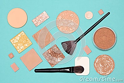 Makeup flatlay. Make-up foundation, concealer, powders with brushes and cosmetic sponges Stock Photo