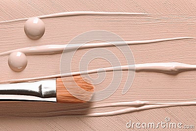 Makeup liquid foundation background. BB, CC cream, concealer smudged, drops and cosmetic brush Stock Photo