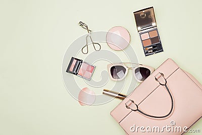 Makeup products with cosmetic bag on color background Stock Photo