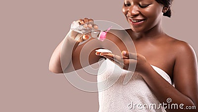 Makeup Removing Concept. African American Woman Applying Micellar Water On Cotton Pad Stock Photo