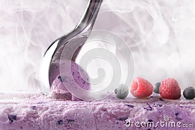 Making a berry ice cream with scoop front view Stock Photo