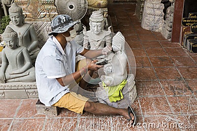 Making Buddha sculpture master at work Editorial Stock Photo